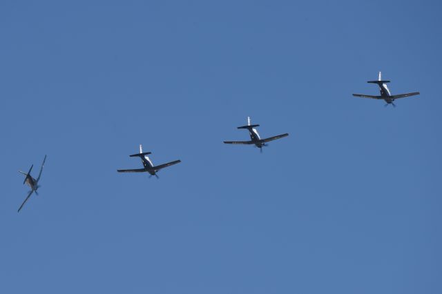 Raytheon Texan 2 — - Four ship formation of T-6A II's arriving over the top of IND 11-12-23. Arriving 5-R. I estimate  that they were approximately 1500-2000 AGL here. Zoomed out all the way and cropped down quite a bit.