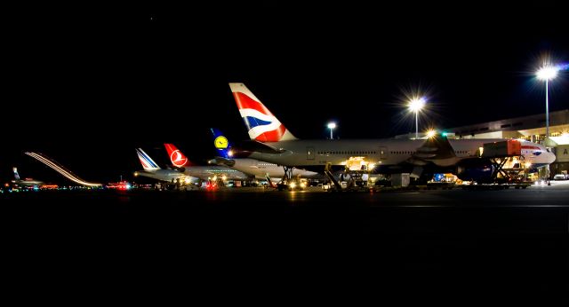 Boeing 777-200 (G-VIIK) - A tale of tails @ KBOS Logan Airport Boston, Ma 02128