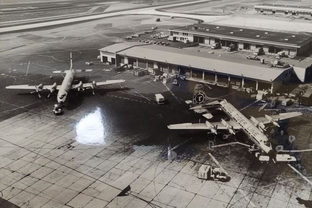 Canadair CL-44 Forty Four — - *NOT MY PHOTO* Scanned and uploaded by permission of the Flying Tiger Archives files. Rare shot of three Flying Tiger Line Connies. Not sure of the airport. Appreciate any additional information.