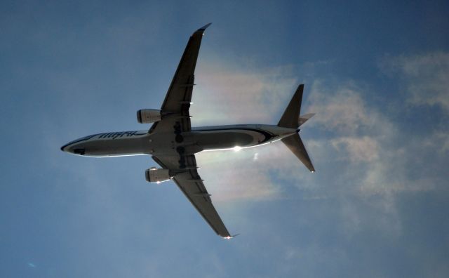 Boeing 737-700 (N570AS) - Making rainbows in the cool Seattle afternoon.