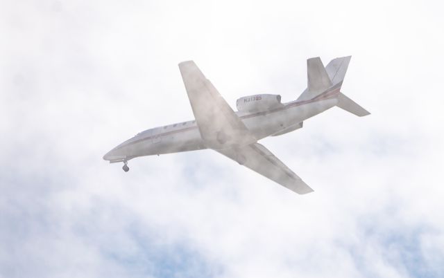 Cessna Citation Sovereign (N313QS) - NetJets Citation Sovereign plows through the clouds on final to HOU from GGG Gregg County, Longview, Texas on May 21, 2021