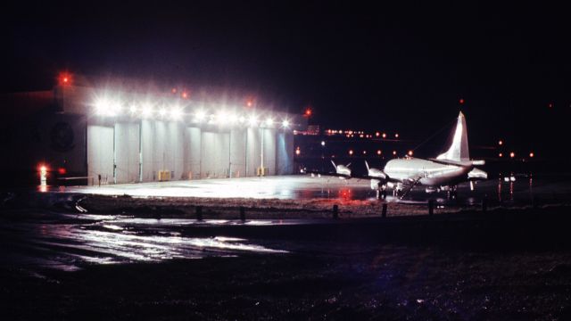 15-7331 — - VP-47 P-3C on a wet (i.e., normal) NAS Adak, Alaska night in front of the hangar