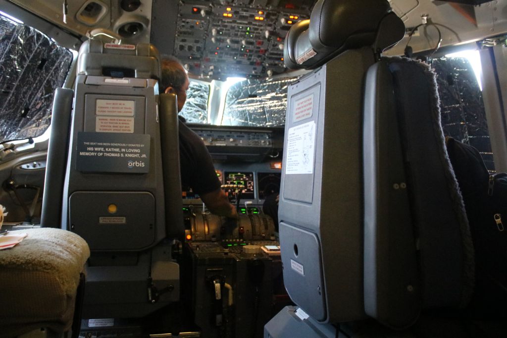 McDonnell Douglas DC-10 (N330AU) - Orbis.org, Mechanic checks cockpit displays, during #2 Engine run up on the tarmac
