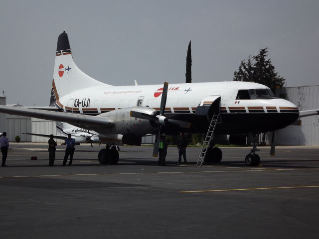 CONVAIR CV-580 (XA-UJI) - Convair 640 waiting cargo at San Luis Potosi