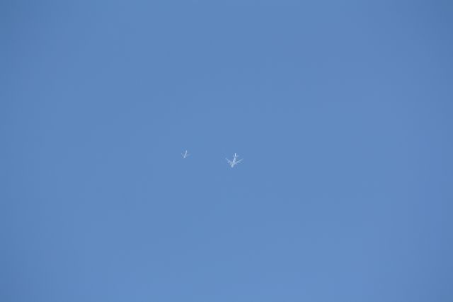 — — - while photographing at Lester B.Pearson I noticed two flights that look like they are flying together kind of an interesting scene of course when i first noticed one was well ahead of the other i just waited till the one was even with the other to take the photograph.