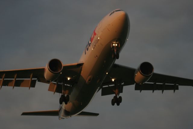 Airbus A300F4-600 — - 6 AM Memphis Flight Arrival at Appleton, WI - Morning sun reflects off aircraft.