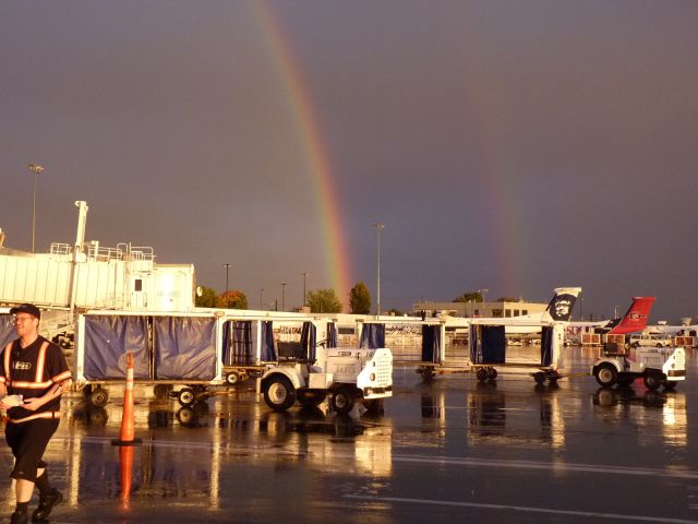 — — - A brief break between down pours. Got the double rainbow goin on.