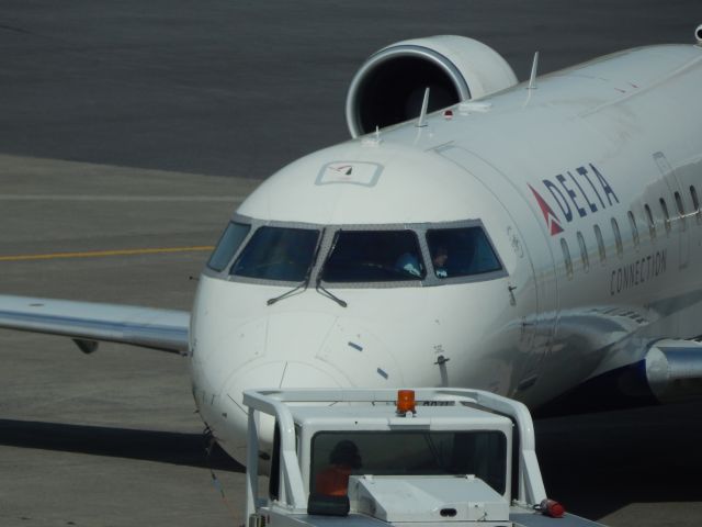 Canadair Regional Jet CRJ-200 (N8971A) - A Delta CRJ200 is pushed back from KALB.