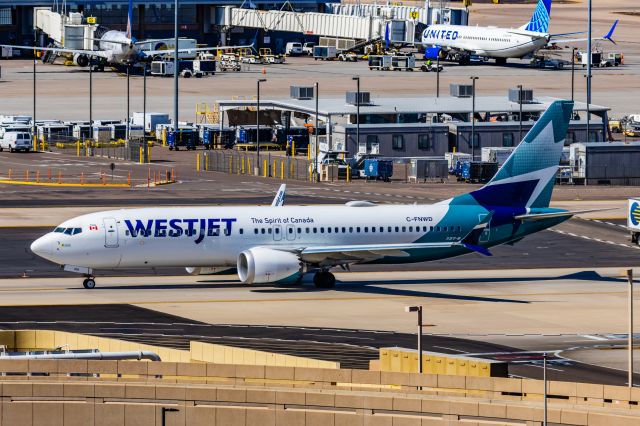 Boeing 737 MAX 8 (C-FNWD) - A WestJet 737 MAX 8 taxiing at PHX on 2/24/23. Taken with a Canon R7 and Canon EF 100-400 ii lens.