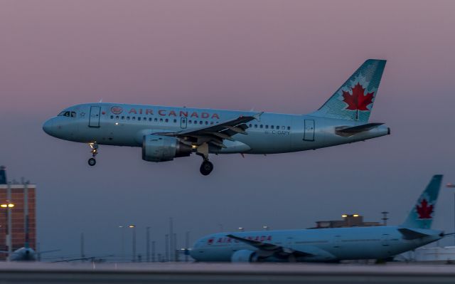 Airbus A319 (C-GAPY) - ACA401 arrives in Toronto from Montreal, testing the limits of my cameras sensor at high ISOs just before sunrise...