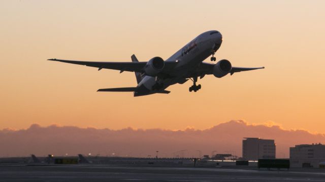 Boeing 777-200 (N859FD) - Sunrise take off from runway 25R, LAX