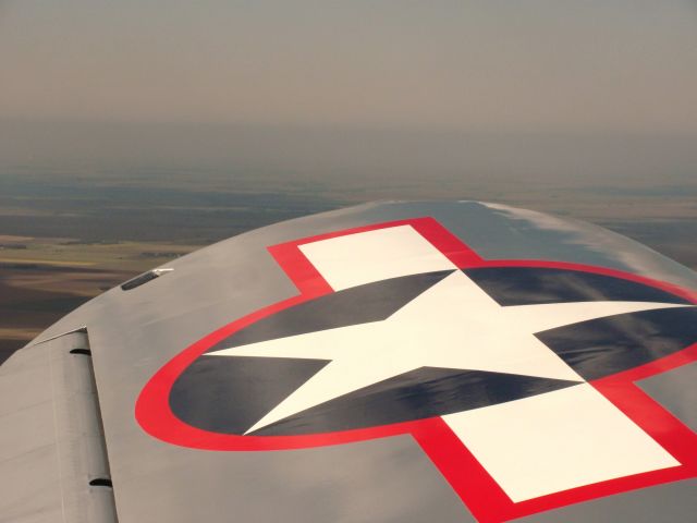 RYAN ST-3KR Recruit (24-3232) - The wing of the PT22 during a flight