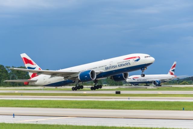 Boeing 777-200 (G-VIIT) - The British are coming, the British are coming!! G-VIIU holding short of 17R while G-VIIT departs 17R at KMCO this afternoon.