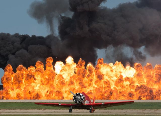 North American T-6 Texan — - Wall of fire at EAA AirVenture Oshkosh. Aeroshell T6 in the foreground.