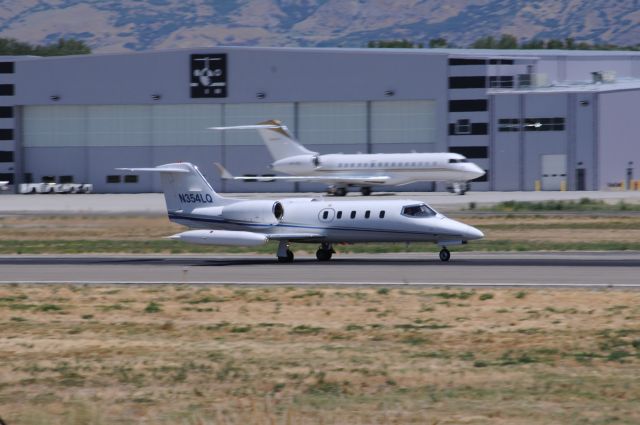 Learjet 35 (N354LQ) - Learjet quite literally blasting out of Provo with Global 6000 (VP-CGL) in the background. br /Best viewed in full! 