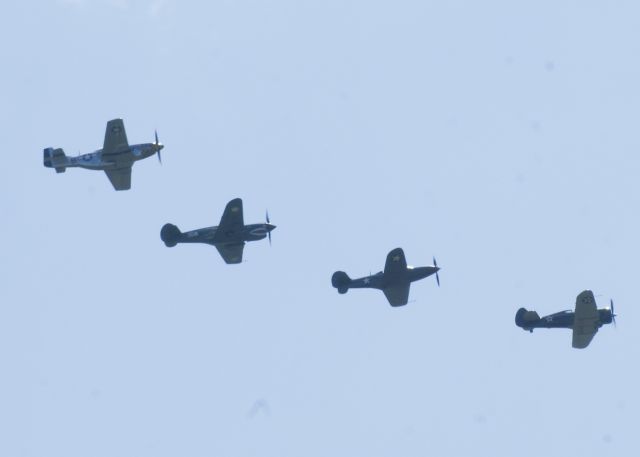 N22518 — - P-64, Airacobra N33FF, Warhawk N1941P, and Mustang N51EA overhead. An amazing Warbirds over the Beach 2021 airshow at Jerry Yagen’s Military Aviation Museum at Pungo, VA near Virginia Beach, 2-3 October 2021. If you’ve never attended one of his airshows, you ought to check it out. Multiple formations of US Army Air Corps, US Navy, RAF, and German aircraft. With Covid, this show was a combined WWI, WWII, etc. airshow. 