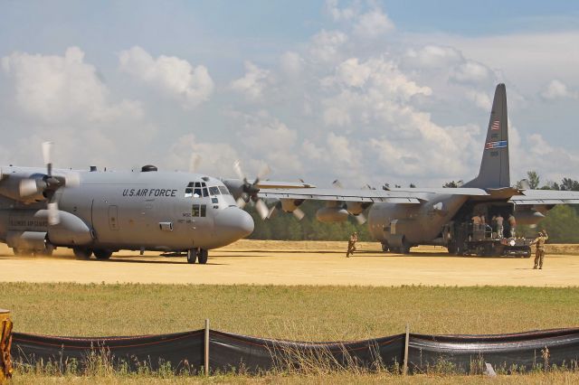 Lockheed C-130 Hercules (92-1452) - USAF Special Operations Combat Control Specialists (CCT) working in close-quarters to guide a USAF Lockheed C-130, 92-1452, cn 382-5329, from the 169th Airlift Squadron (AS), 182d Airlift Wing (AW), Peoria, Illinois past a USAF Lockheed C-130, 89-9106, cn 382-4852, from the 910th Airlift Wing (AW), Youngstown, OH (Air Force Reserve Command) at Fort McCoy/Young Tactical Landing Site-Air Assault Strip, Ft. McCoy, (WS20) USA – WI, during Warrior Exercise 86-13-01 (WAREX) on 17 Jul 2013.