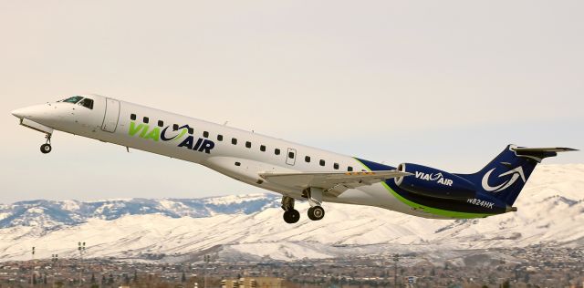 Embraer ERJ-145 (N824HK) - On the climb away from Reno Tahoe Internationals runway 16L, "Stingray Two Tree," a Via Air Embraer ERJ-145LR, departs empty after dropping off Republican Presidential candidate Ted Cruz and his group.