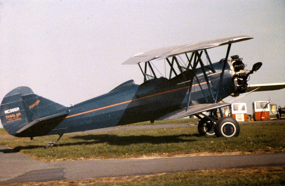 JORDAN AEROSPACE Sama (N365M) - Travel Air N365M photographed in mid-1980s at Cumberland, MD. This photo was scanned from a 35mm slide. I used Photoshop to bring back some of the color and crop out a little bit of white at the edge of the image. Otherwise, this is exactly as photographed back in the day. I believe this was at an air show or open house.