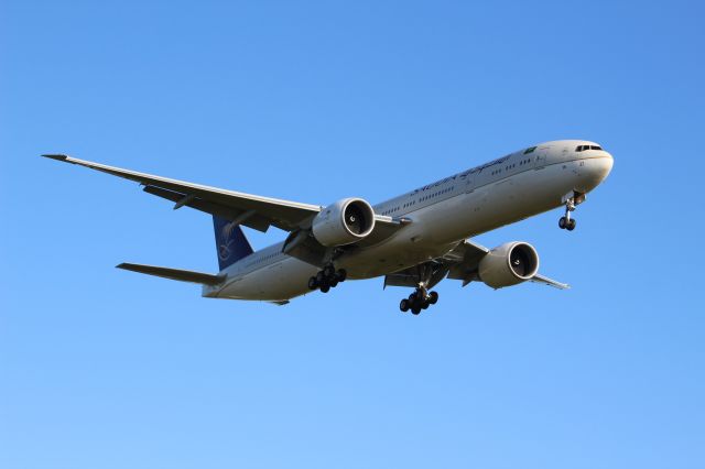 BOEING 777-300ER (HZ-AK37) - A Saudia B777-300ER on final approach into LHR, landing on runway 09L.br /br /Location: Stanwell Moor Road.br /Date: 20.06.22 (dd/mm/yy)