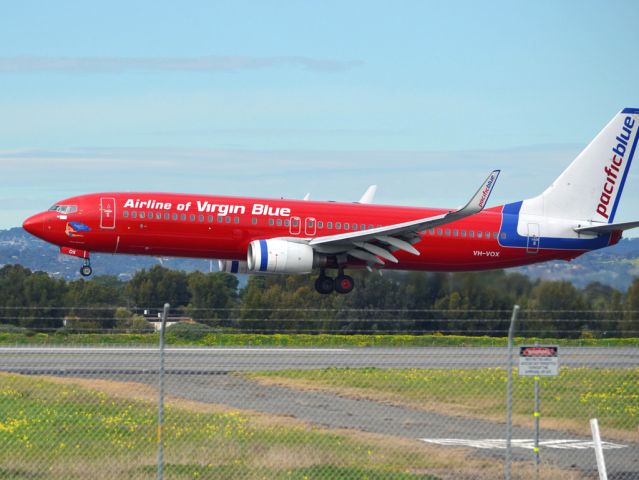Boeing 737-800 (VH-VOZ) - About to put down on runway 05. Thursday 12th July 2012.