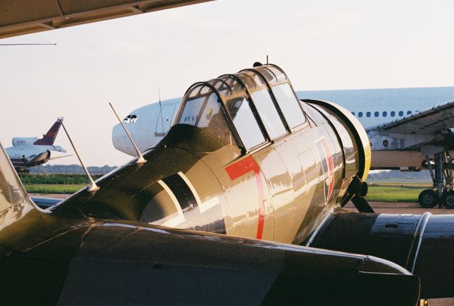 North American T-6 Texan (N96143) - T-6G at Greenwood-Leflore KGWO circa 2001. The Texan still flies. Those other hapless birds in the background never left the ground again.