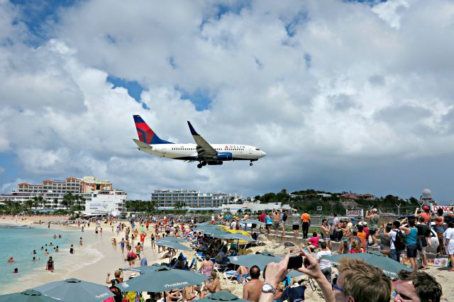 Boeing 737-700 — - Taken from the Sunset Beach Bar