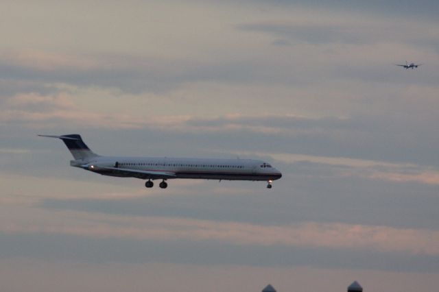 McDonnell Douglas MD-81 (N682RW) - This MD81 about to land on Boston Logan's runway 27 chartering the Detroit Tigers to Boston to play the Red Sox in a three  game series at Fenway. In back a British Airways B789 lined up to land on 33L on 5/2/21. 