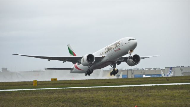 Boeing 777-200 (A6-EFI) - UAE778 climbs from runway 16R during a rain storm to begin its delivery flight to VHHH / HKG on 11/29/12. (LN:1060 c/n 35609).