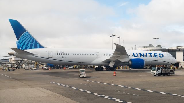BOEING 787-10 Dreamliner (N12020) - Parked at the gate as seen from a taxiing plane. 