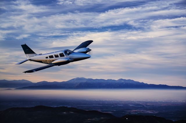 Piper Seneca (N31999) - East of KSNA at 3,000. Orange County visible below. Photo by Mike Fizer.