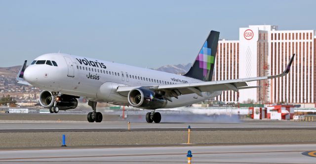 Airbus A320 (XA-VLM) - VOI's "Jesus" touching down on 16L to complete the first half of a Guadalajara-Reno-Guadalajara round trip run.