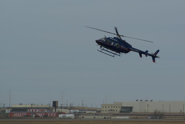 Bell 407 (N520MT) - Bell 407 Lifestar doing autorotation training at Rick Husband Intl Airport in Amarillo, TX.