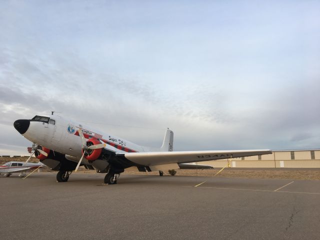 Douglas DC-3 (N34AH) - The sun and age are starting to take its toll on the fabric covered surfaces.  Tire is flat too.