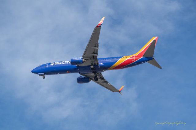 Boeing 737-700 (N8305E) - Flight departing DEN airport, as observed from the Avis Rental Car Lot.  