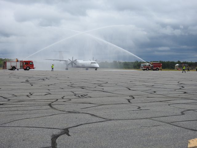 — — - Traditional welcome to Porter Air's first flight to Muskoka CYQA Canada