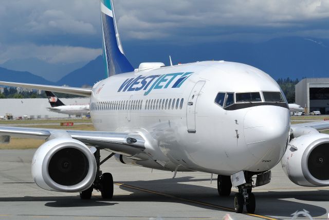 Boeing 737-700 (C-FKIW) - The aerodynamic cleanup in the 737 MAX tail cone eliminates the aft fuselage vortex generators found on NG models like this WestJet 737-700