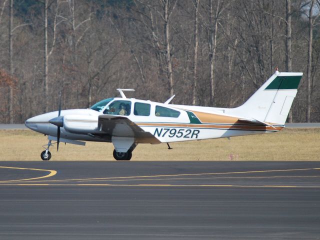 Beechcraft 55 Baron (N7952R) - J&J BEYERLE AIR taxiing in at KJQF - 1/29/13