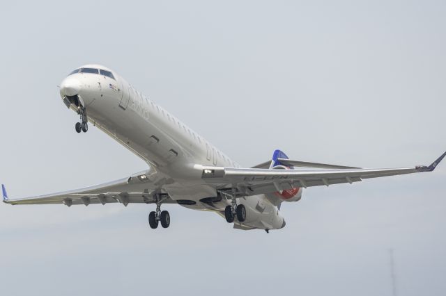 Canadair Regional Jet CRJ-900 (EI-FPN) - Standning Next to Runway 04L