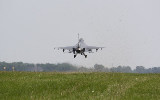 Lockheed F-16 Fighting Falcon — - Not the greatest picture but up close you can see the grass shooting up in the air from the exhaust,Landing London,Canada,CYXU/YXU