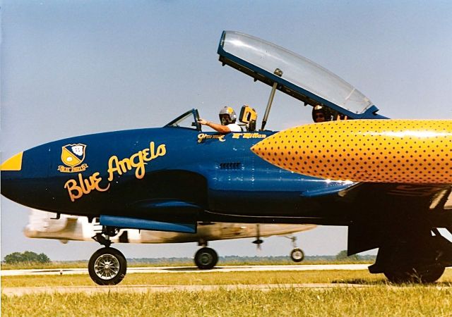 Lockheed T-33 Shooting Star — - Private owned T-33 taxing by at the EAA Fly In. Note the rotating B-25 passing behind it.