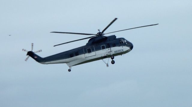 Sikorsky Sea King (N625CK) - Hovering above is this 1963 Sikorsky Sea King Rotorcraft in the Summer of 2018. Used to haul cargo, personel and assist in Fire Fighting efforts over the years.  Beyond the tail rotor is a bird, dragonfly or ufo. 