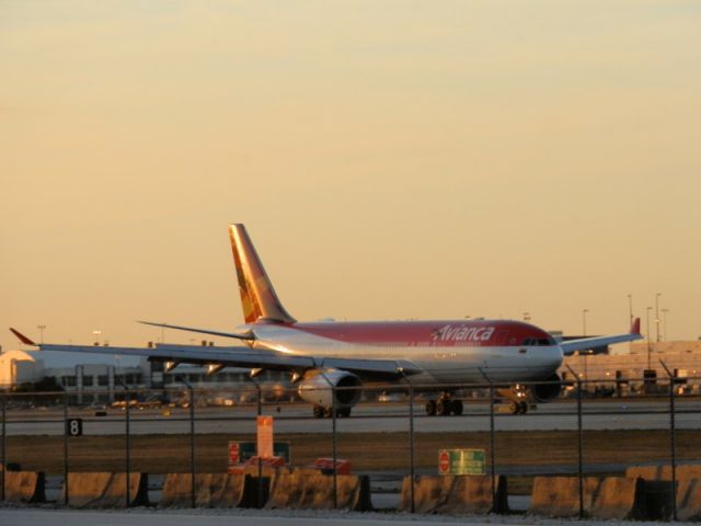 Airbus A330-200 (N975AV) - Glistening,in the sunset!