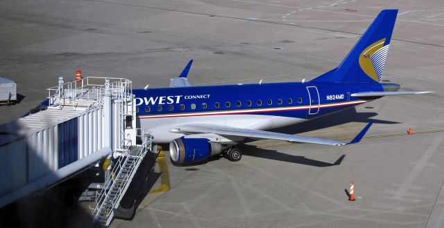 Embraer 170/175 (N824MD) - Flashback to 2009 ~~br /A Midwest Connect (Midwest Airlines {MEP} - now defunct) Embraer is caught here at a DFW gate.br /In 2010, one year after this picture was taken, Midwest Airlines ceased operations. The aircraft seen here began flying for Shuttle America {TCF}, but when Shuttle America folded its tent this aircraft was acquired by Republic {RPA} and remains in operation today dressed in Delta Connection clothing and still registered N824MD..