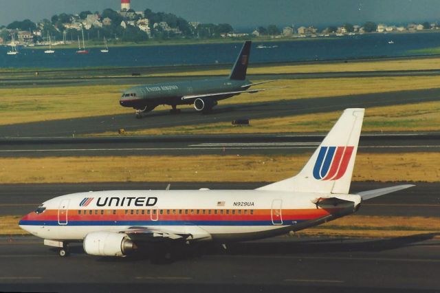 Boeing 737-500 (N929UA) - From August 1997...Note the old colors B737 with the "new" colors gray scheme in back. This B737-500 also flew as Shuttle by United. 