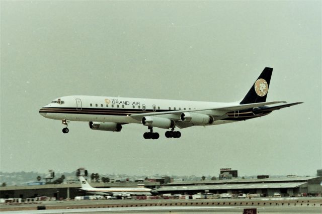 McDonnell Douglas DC-8-60 (N803MG) - KLAX - I wanna say this is January 1999 or 2000, Parked at the wrong view lot, but glad I got the photo - this MGM Grand Air DC-8 will park at the old Imperial Terminal - usually tugged in backwards at Imperial. The MGM Aircraft were usually very clean looking.