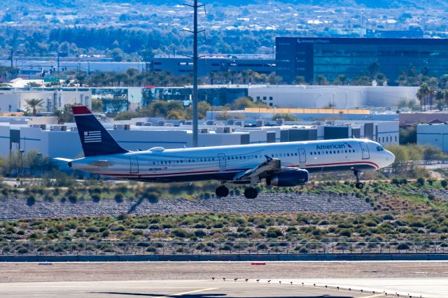 Airbus A321 (N578UW) - An American Airlines A321 in US Airways retro livery landing at PHX on 2/4/23. Taken with a Canon R7 and Tamron 70-200 G2 lens.