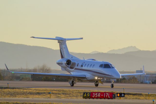 Embraer Phenom 300 (N363QS) - Rolling off of 35R on high-speed A9 during sunset at KAPA.