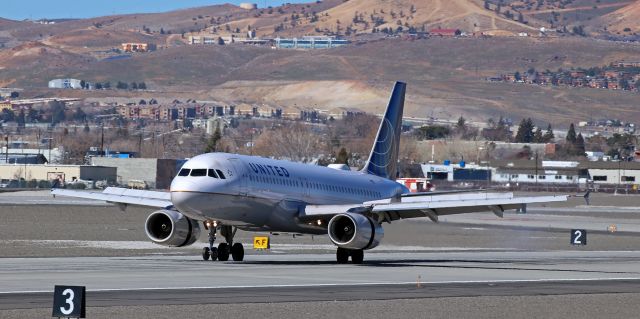Airbus A320 (N445UA) - With dirty wings and reverse thrust, United's N445UA is already engaged in the process of slowing down only seconds after having touched down on 16L to complete a flight from Denver.