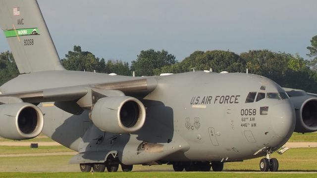 Boeing Globemaster III (98-0058) - This C17 seems to be wider than the taxiway, as the tires seem to be kicking up some Texas dust.